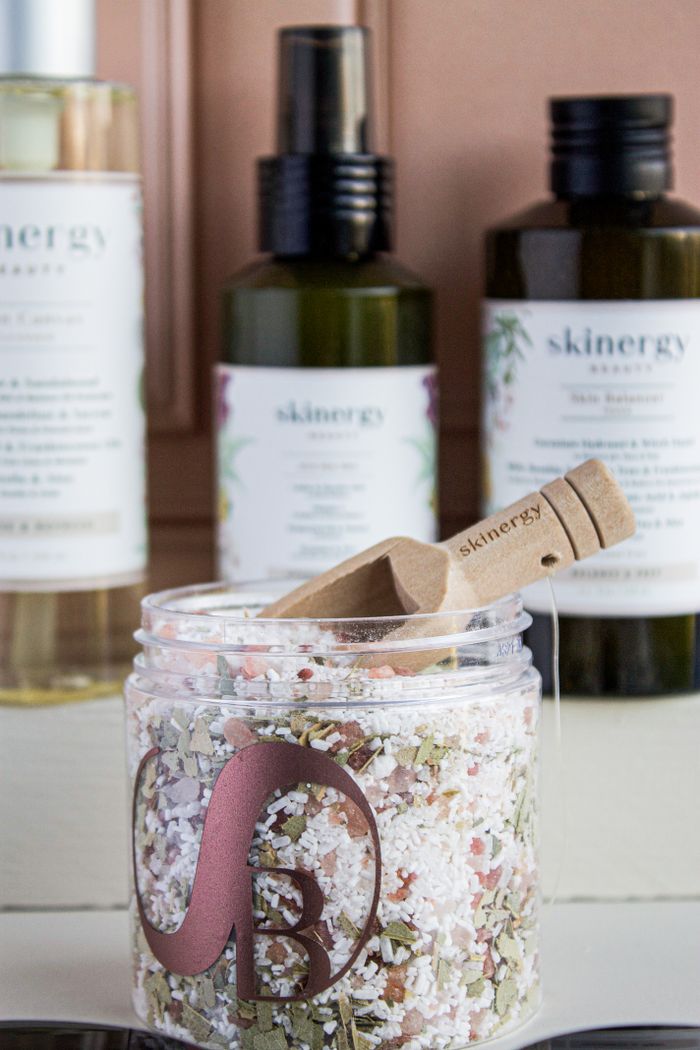 High-end skincare products featuring bath salts and essential oils for a spa-like experience.