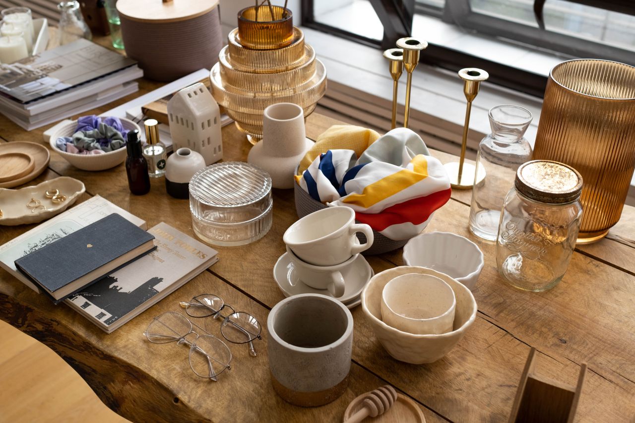 Explore a curated mix of home decor items elegantly arranged on a wooden table.